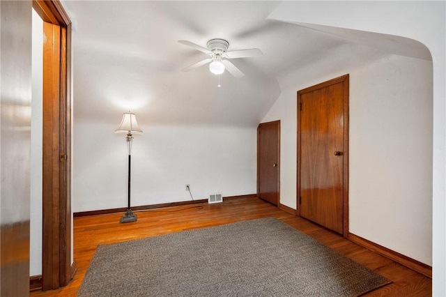 bonus room featuring wood-type flooring, vaulted ceiling, and ceiling fan