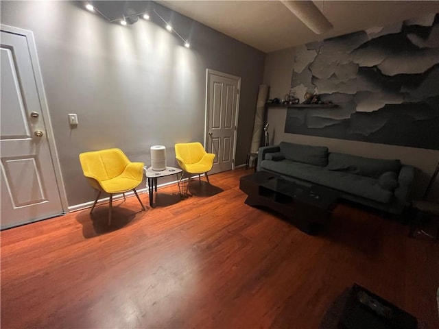 sitting room with hardwood / wood-style flooring