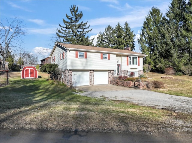 bi-level home with a garage and a front lawn