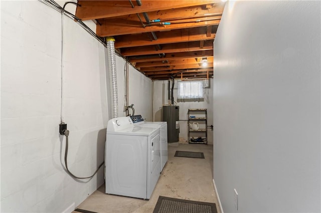 laundry area with separate washer and dryer and water heater