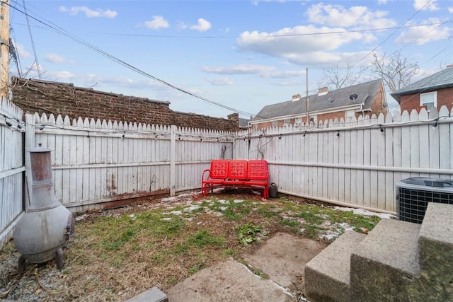 view of yard featuring central AC