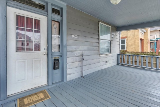 property entrance featuring covered porch