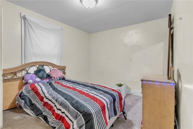 bedroom featuring light carpet