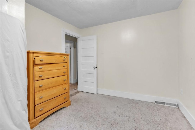 bedroom featuring light colored carpet