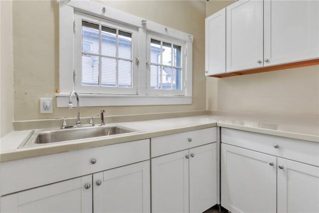 kitchen with sink and white cabinets