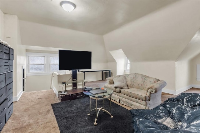 carpeted living room with vaulted ceiling