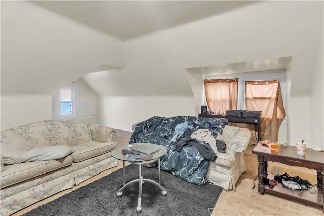 carpeted living room with vaulted ceiling