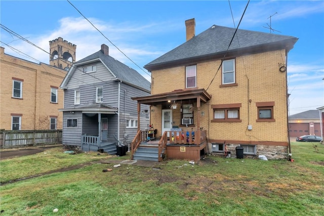 rear view of house with a lawn