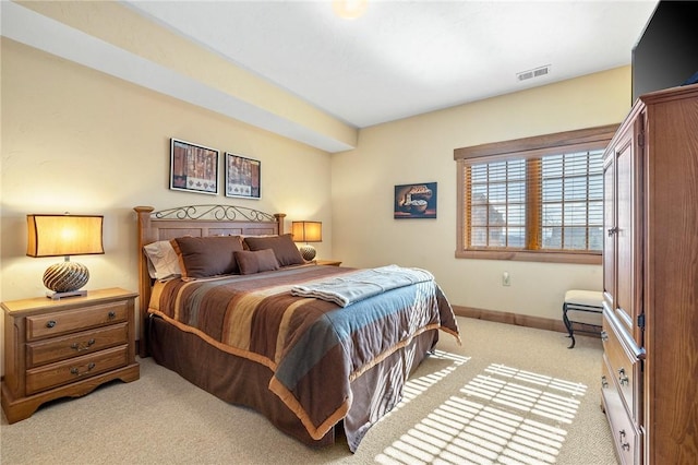 bedroom featuring light carpet