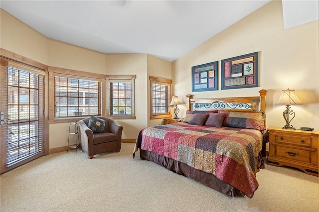 bedroom with vaulted ceiling and carpet