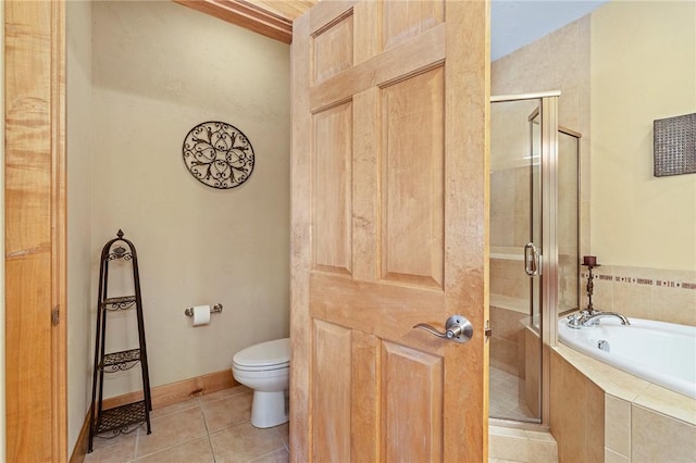 bathroom with shower with separate bathtub, tile patterned floors, and toilet