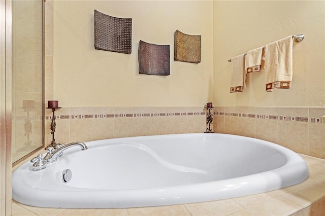 bathroom featuring tiled bath