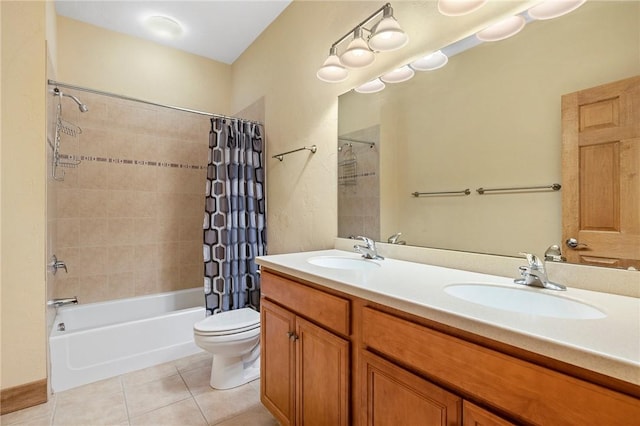 full bathroom featuring vanity, shower / bathtub combination with curtain, tile patterned floors, and toilet