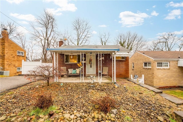 view of front of home featuring a patio and covered porch