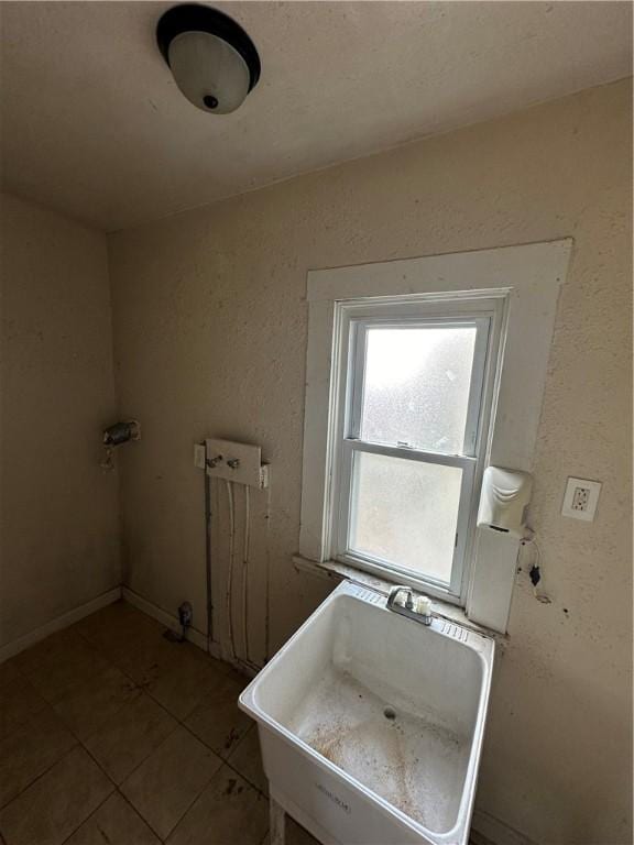 bathroom featuring tile patterned flooring and sink