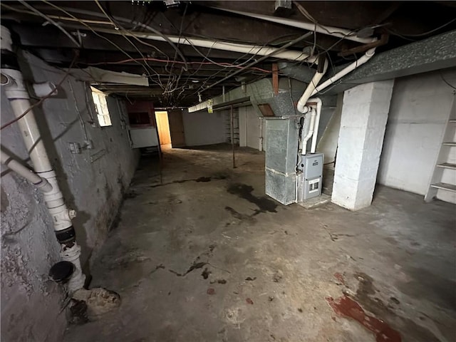 basement featuring heating unit