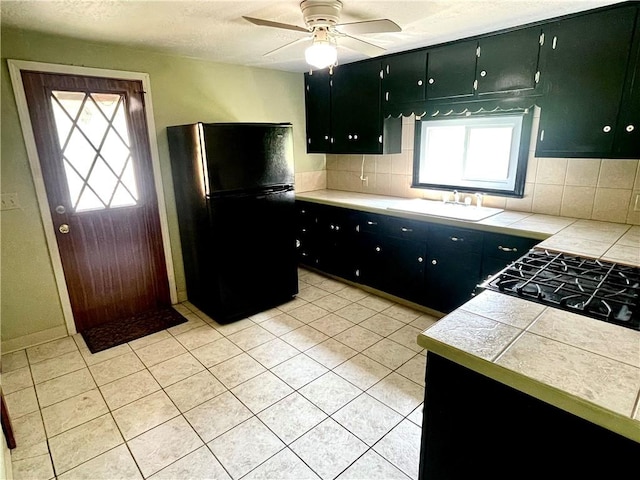 119 Whitestown Rd, Twp Of But Se, PA 16045 - kitchen with freestanding refrigerator, tasteful backsplash, a sink, ceiling fan, and cooktop