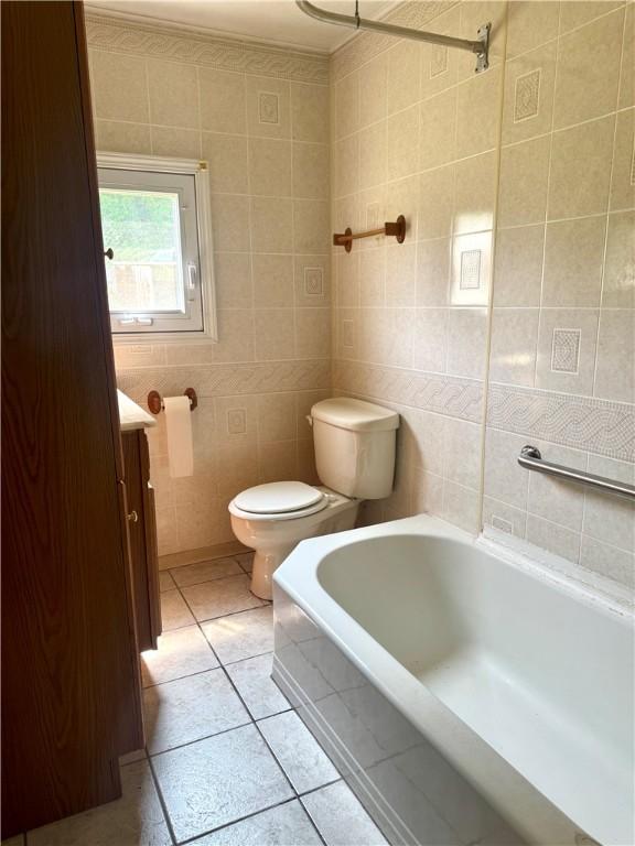 119 Whitestown Rd, Twp Of But Se, PA 16045 - full bathroom with a tub, toilet, tile walls, tile patterned flooring, and vanity