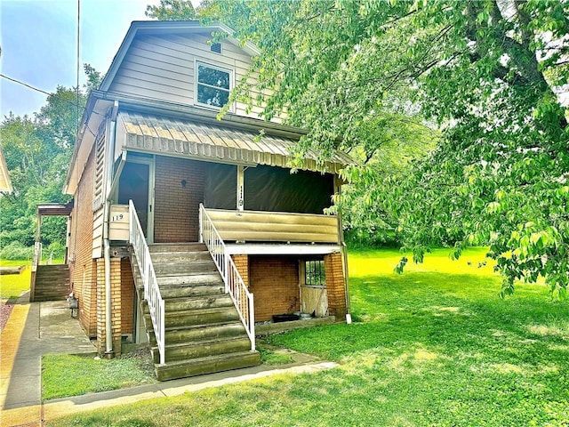 119 Whitestown Rd, Twp Of But Se, PA 16045 - rear view of property with stairs, a lawn, and brick siding