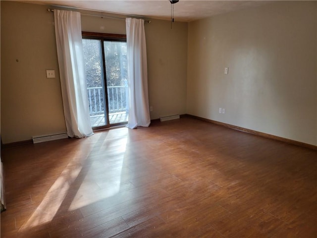 empty room with hardwood / wood-style floors