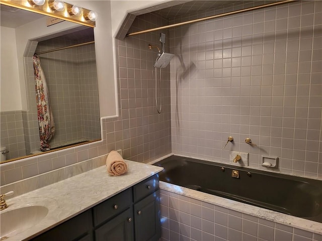 bathroom featuring vanity, tile walls, and shower / tub combo