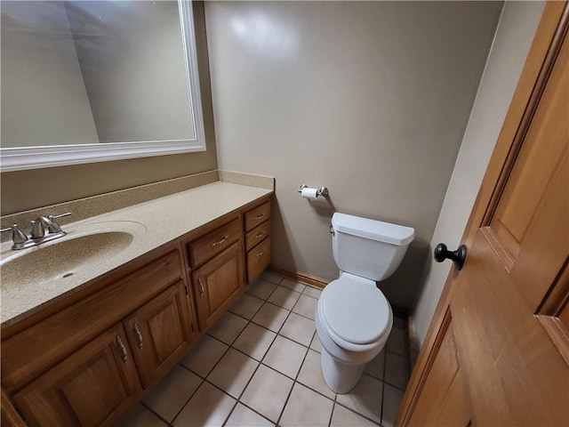 bathroom with tile patterned floors, vanity, and toilet