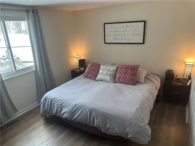 bedroom with wood-type flooring