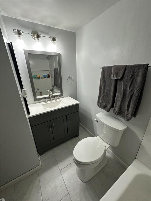 bathroom with a tub to relax in, vanity, and toilet