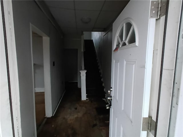 corridor featuring a paneled ceiling