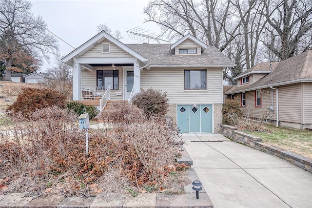 view of front of property featuring a garage and covered porch