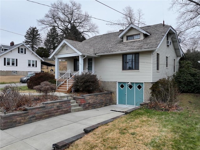 bungalow-style house with a front yard