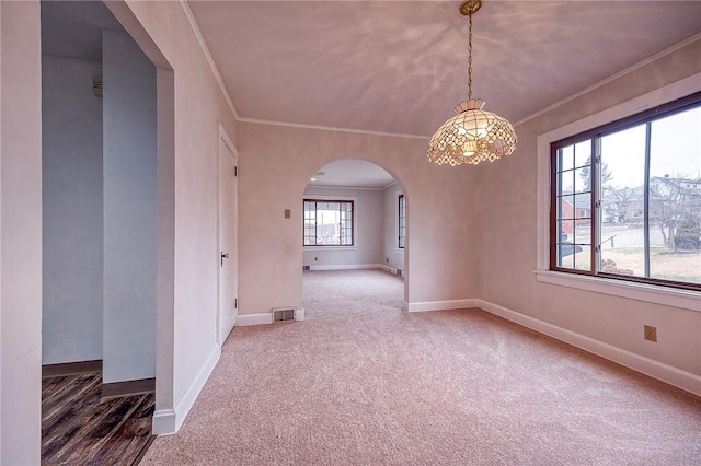 carpeted empty room with crown molding