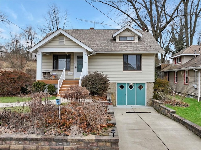 view of front facade featuring a porch and a garage