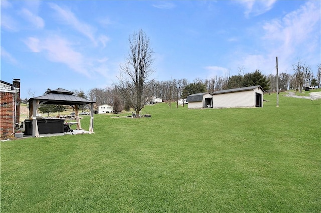 view of yard with a storage shed and a gazebo