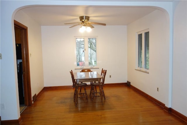 dining room featuring hardwood / wood-style floors and ceiling fan