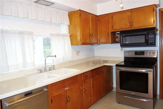 kitchen featuring appliances with stainless steel finishes and sink