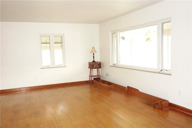 spare room featuring hardwood / wood-style floors