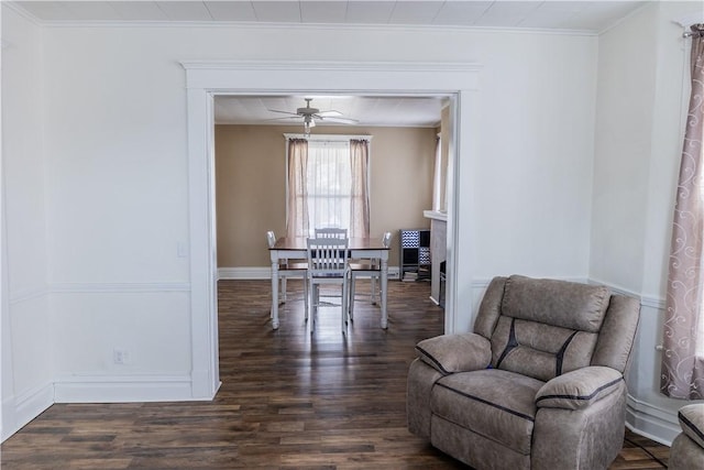 dining space with crown molding, ceiling fan, and dark hardwood / wood-style floors