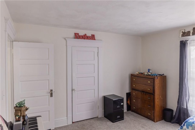 bedroom with light colored carpet