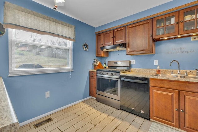 kitchen with sink, dishwasher, and stainless steel stove