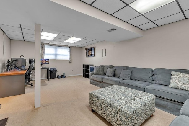 living room featuring a paneled ceiling and light carpet