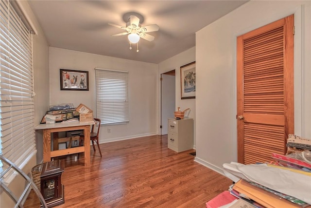 office area with wood-type flooring and ceiling fan