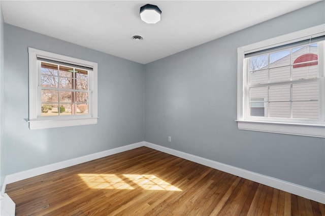 empty room featuring hardwood / wood-style floors