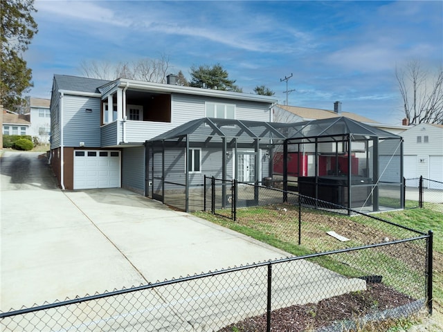 view of front facade with a garage, a lanai, and a front yard