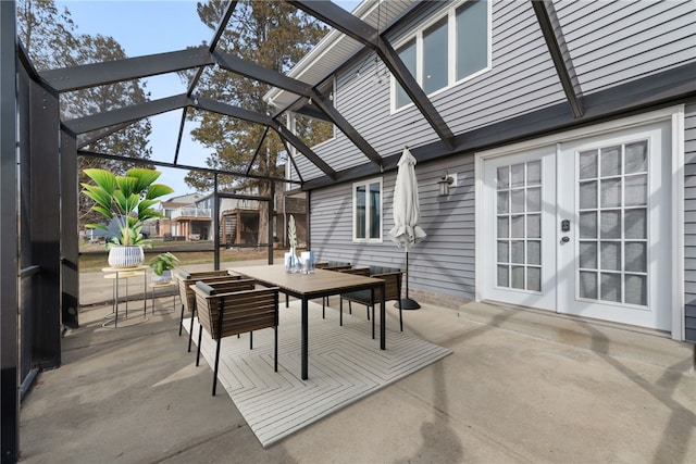 view of patio / terrace with french doors and glass enclosure