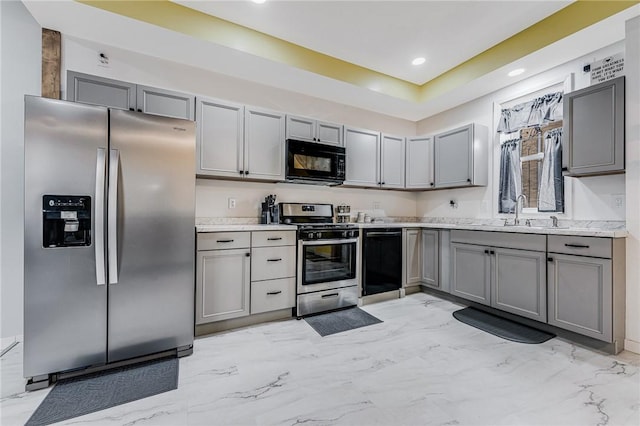 kitchen with gray cabinets, sink, and black appliances