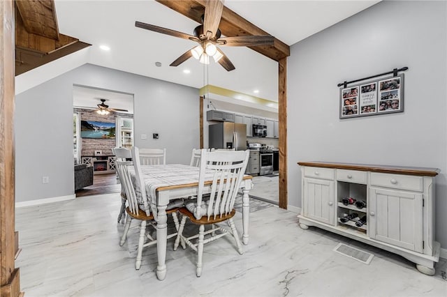 dining space featuring beamed ceiling and ceiling fan