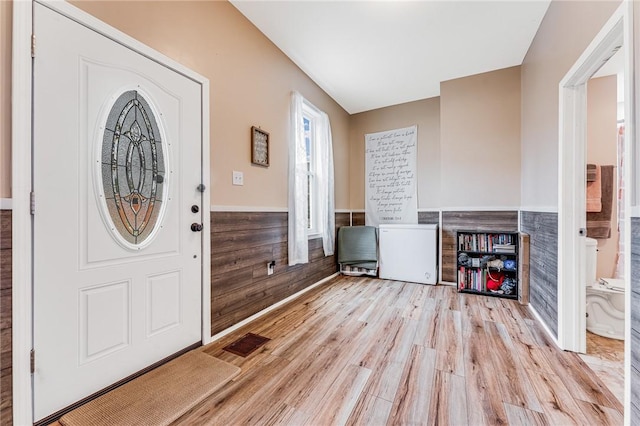 entryway with light hardwood / wood-style flooring