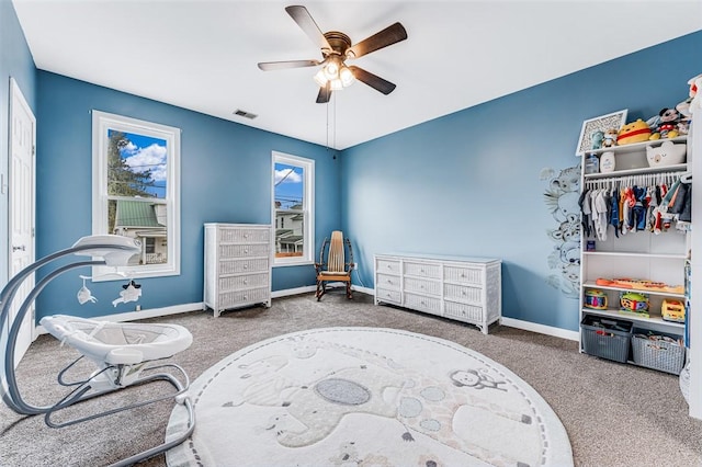 interior space with ceiling fan