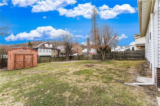 view of yard with a storage unit